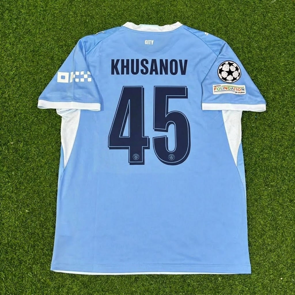 Abdukodir Khusanov #45 Manchester City 2026-27 Home New Season Champions League Patch Jersey – Back View