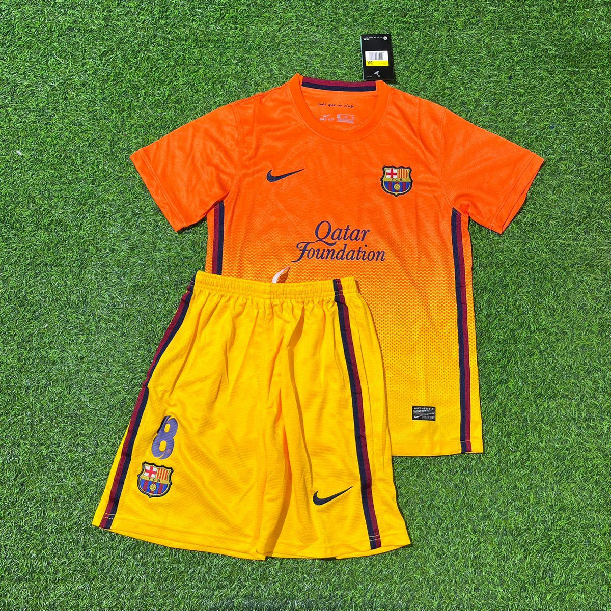 Barcelona 2012/2013 Orange Retro Kids Football Jersey – Andrés Iniesta 8 – Front View